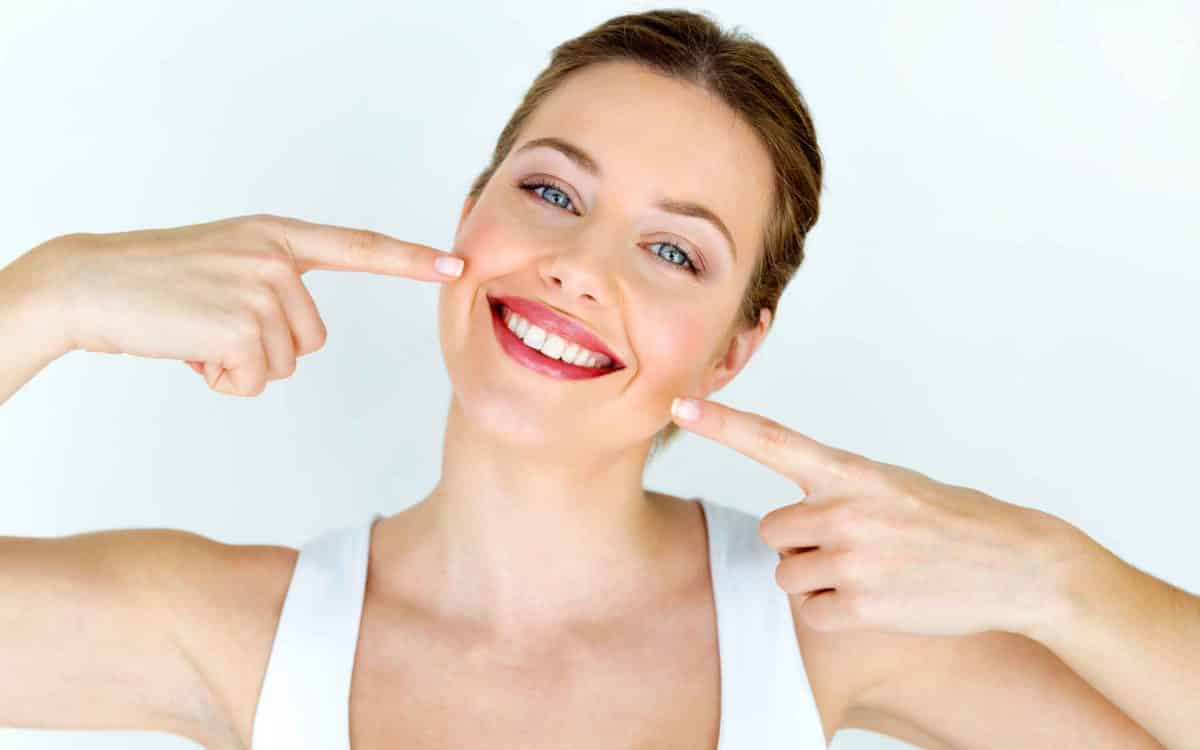 woman has Cosmetic dentistry like cleaned teeth